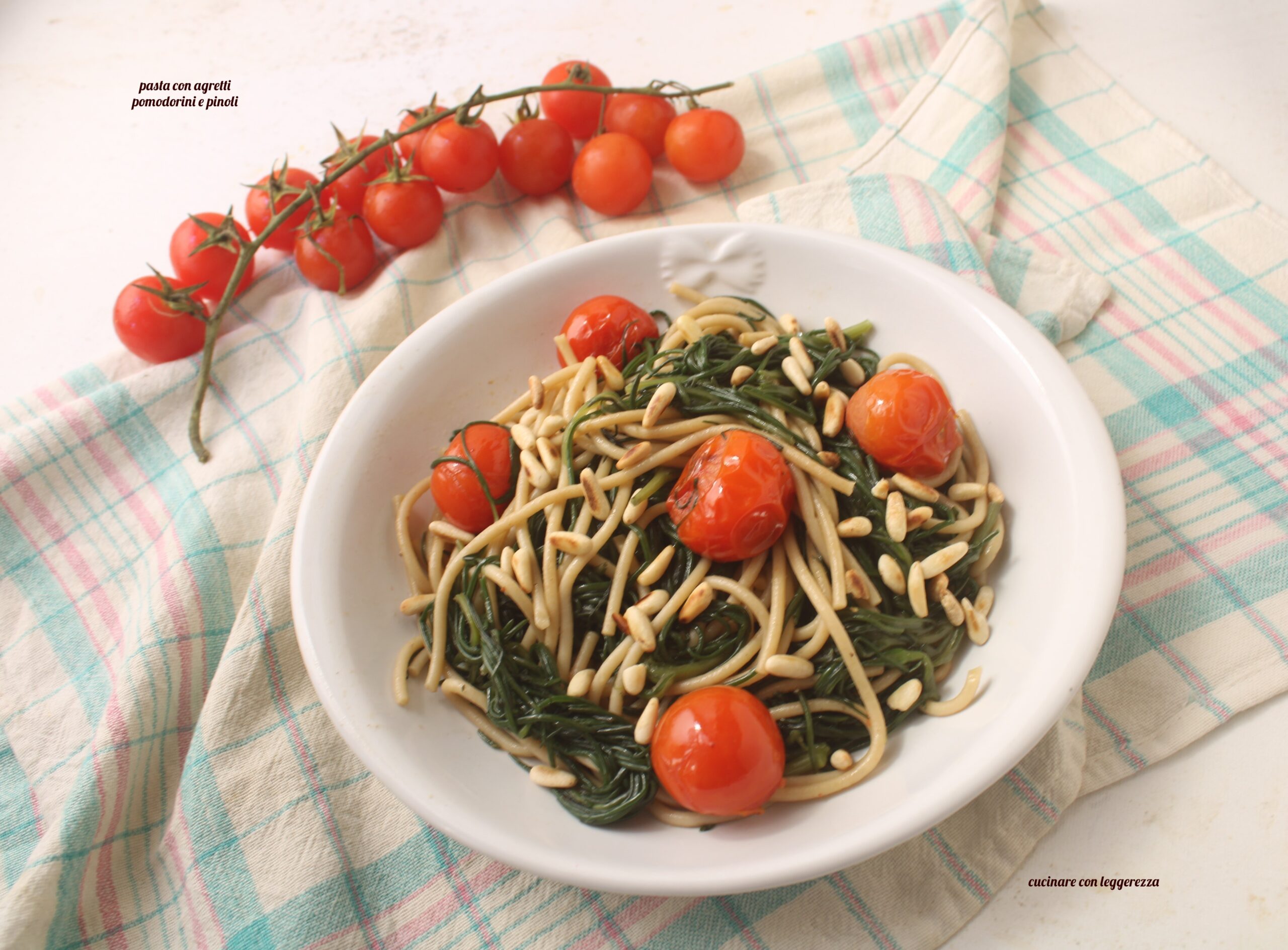 Pasta with agretti, cherry tomatoes and pine nuts