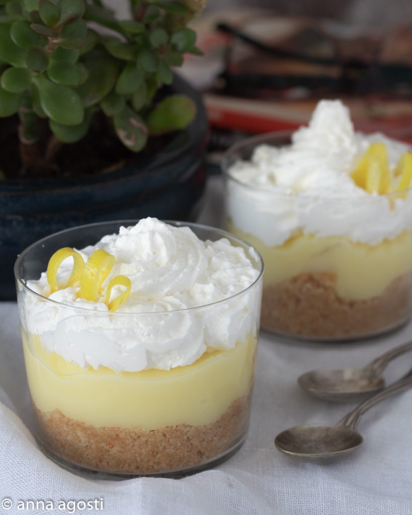 Lemon cream cup with cookies and whipped cream