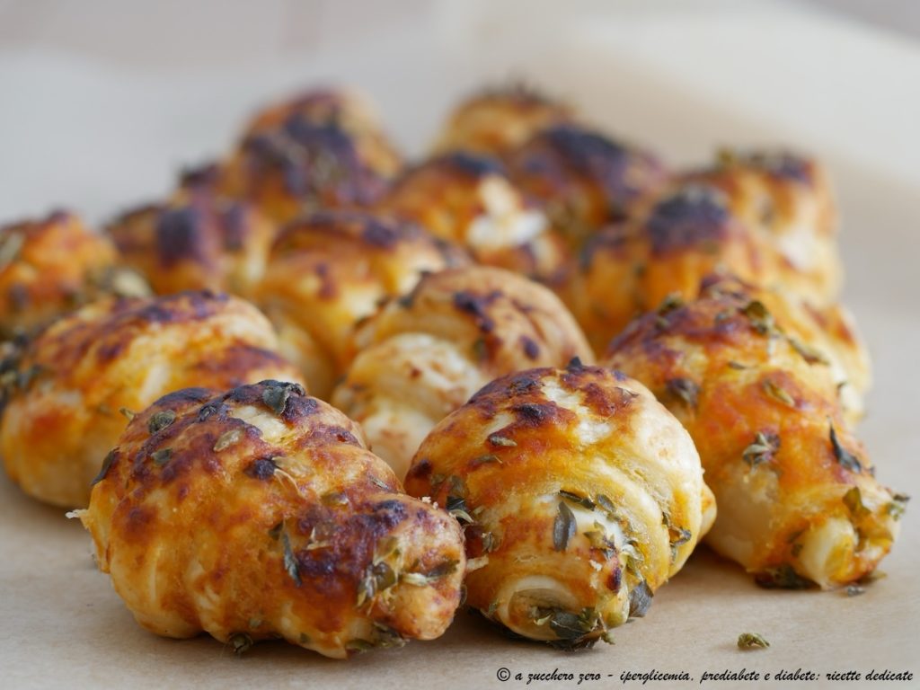 Mini light puff pastry croissants with pizza flavor