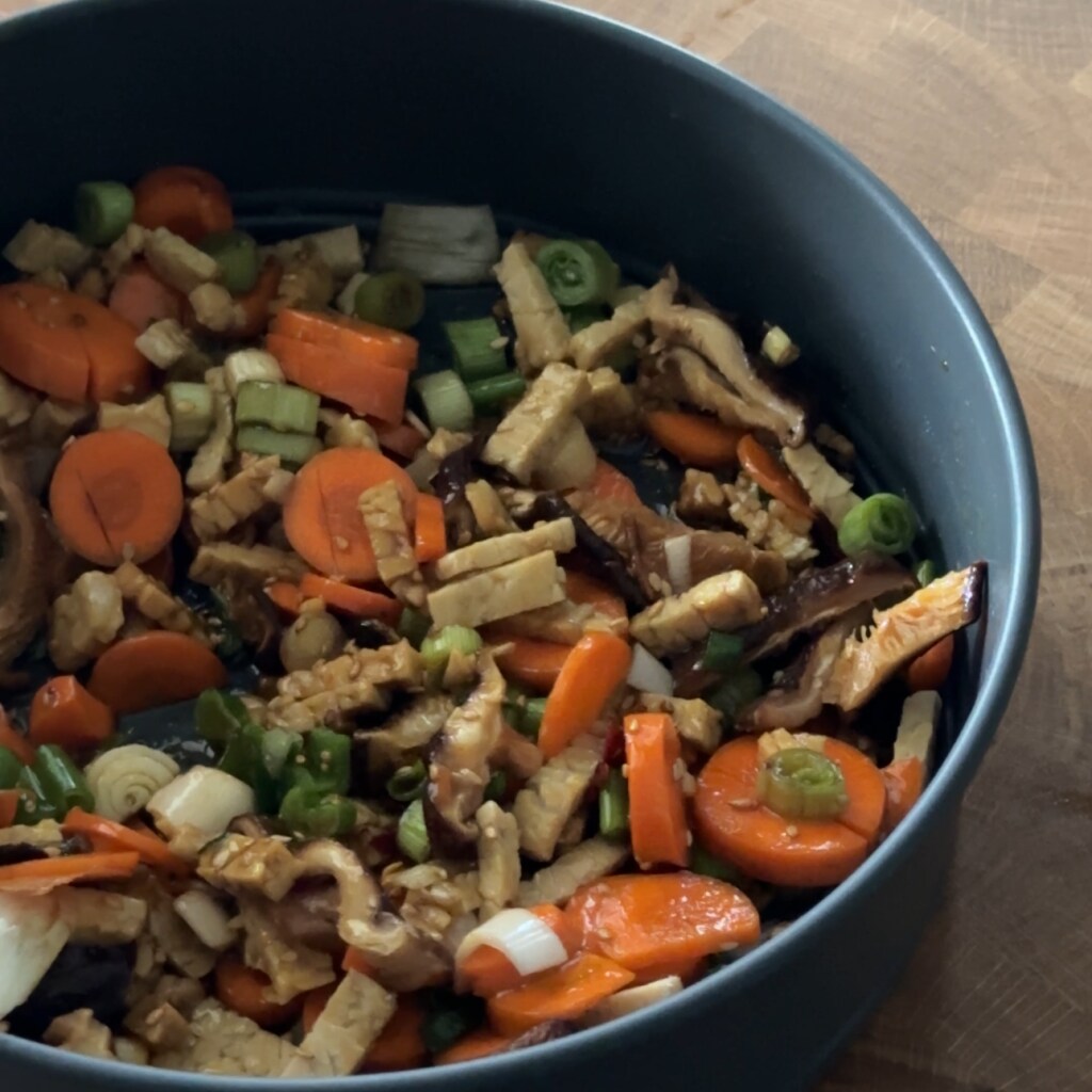 mixed vegetables and tempeh in baking dish