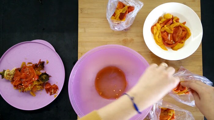 Dividing oven-roasted peppers into freezer bags