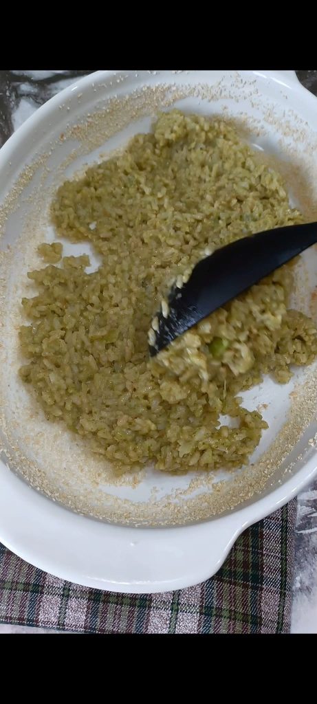 Pour half of the rice into the baking dish