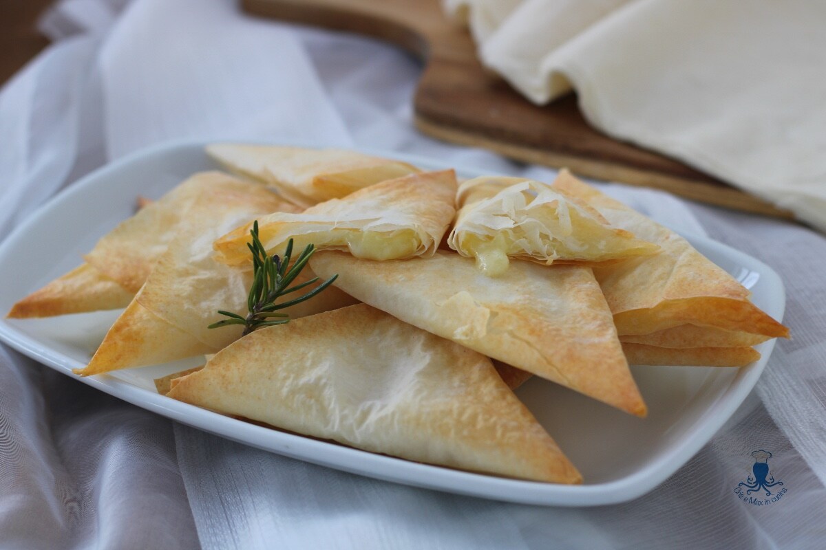 Savory phyllo triangles, delicious baked recipe.