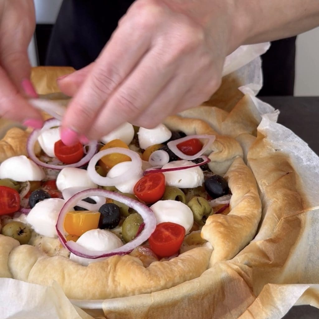 Savory pie with cherry tomatoes and smoked cheese