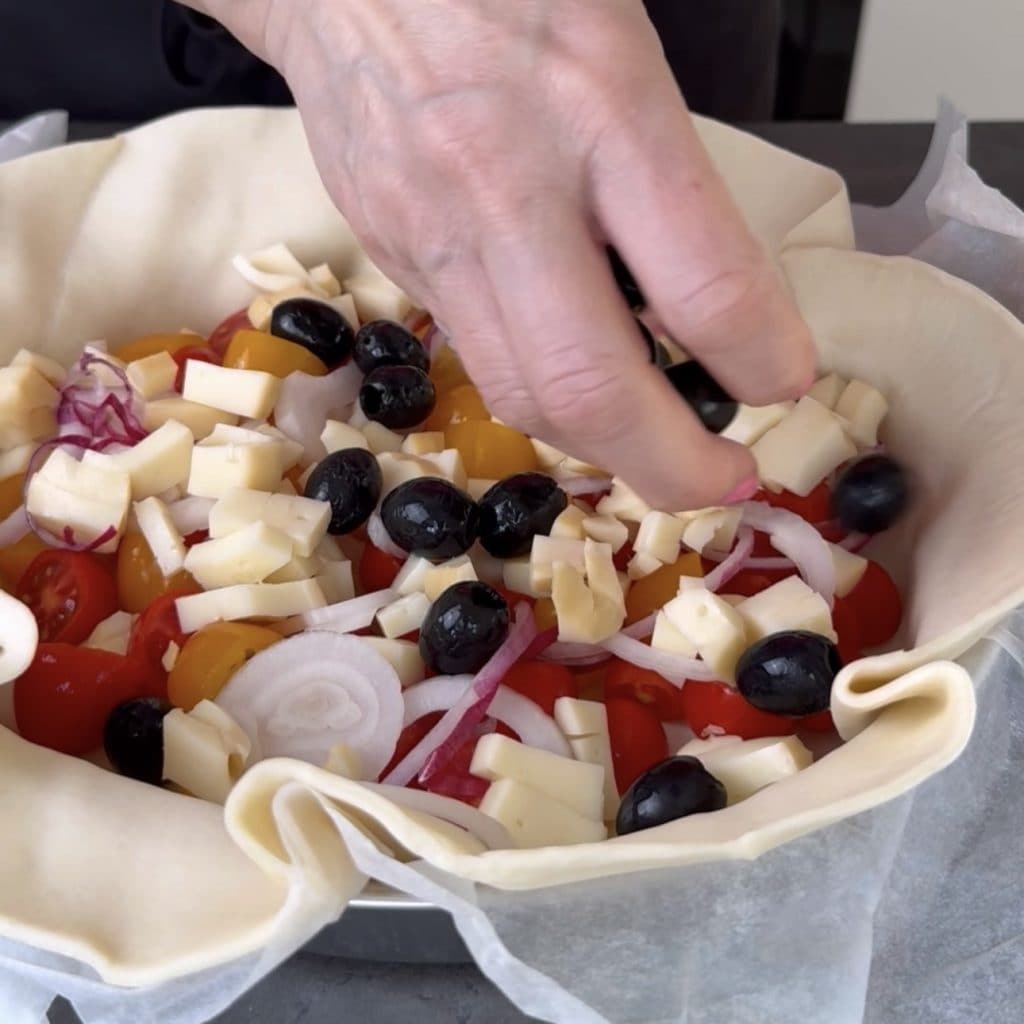 Savory pie with cherry tomatoes and smoked cheese