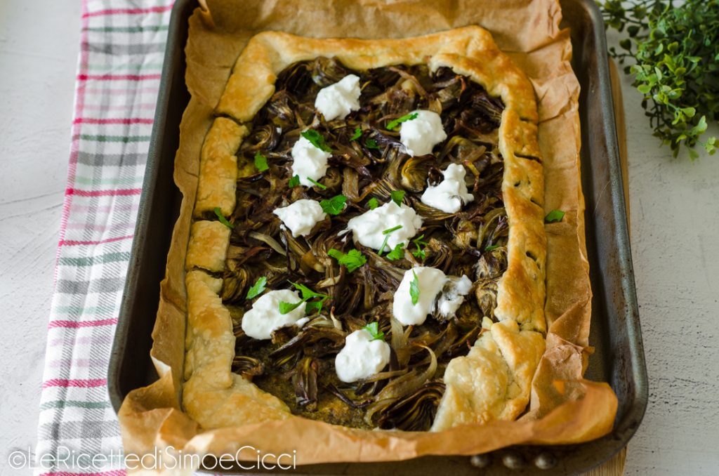 Savory puff pastry pie with artichokes and pesto
