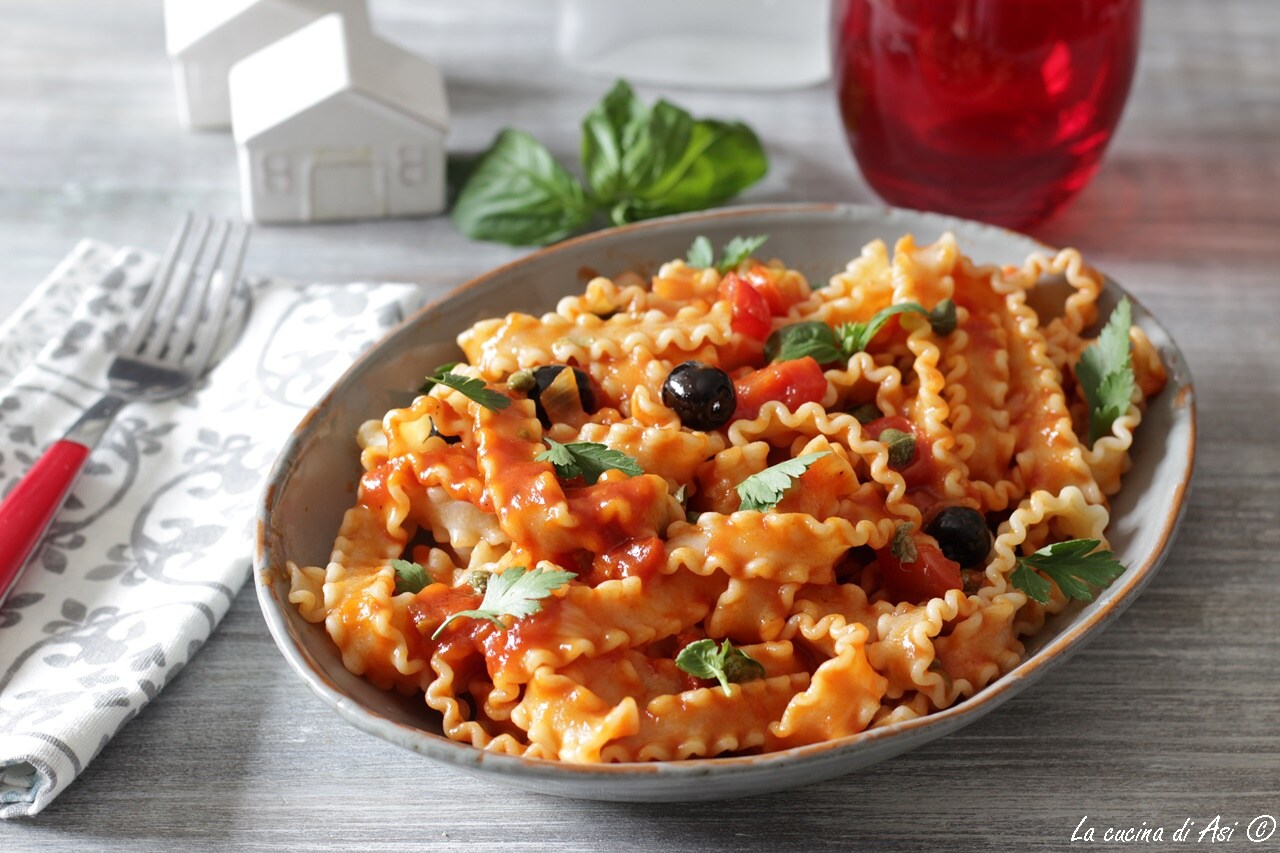 Reginette with olives, capers, and tomatoes