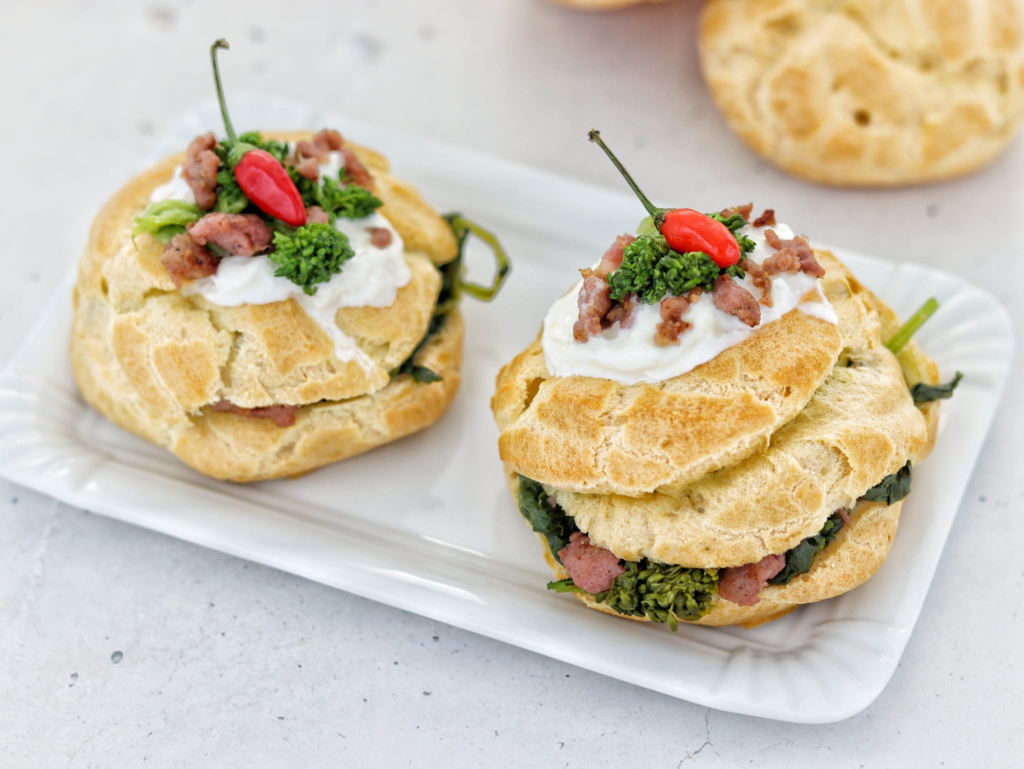 St. Joseph’s Zeppole with Sausage and Greens