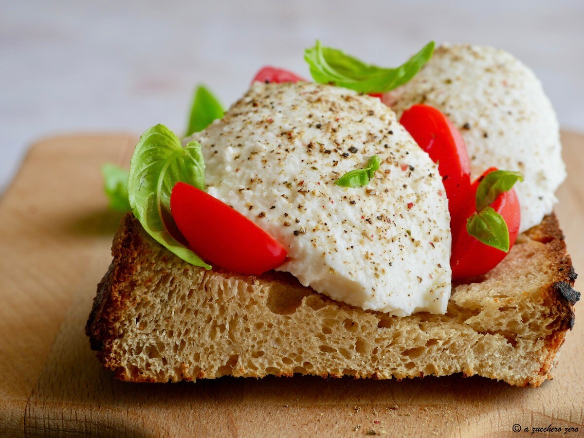 Whole Wheat Bread with Light Spreadable Cheese and Cherry Tomatoes