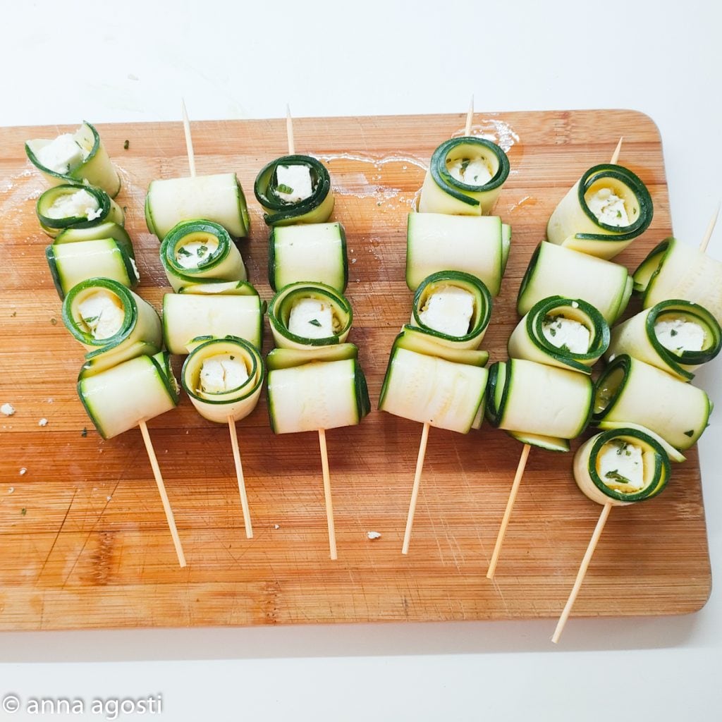 Zucchini and feta skewers in a pan