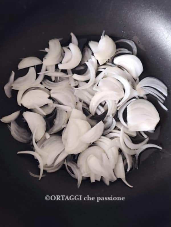 sautéing onion in a pan