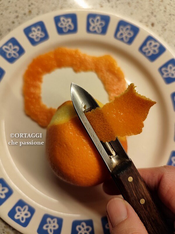 use a peeler to peel orange