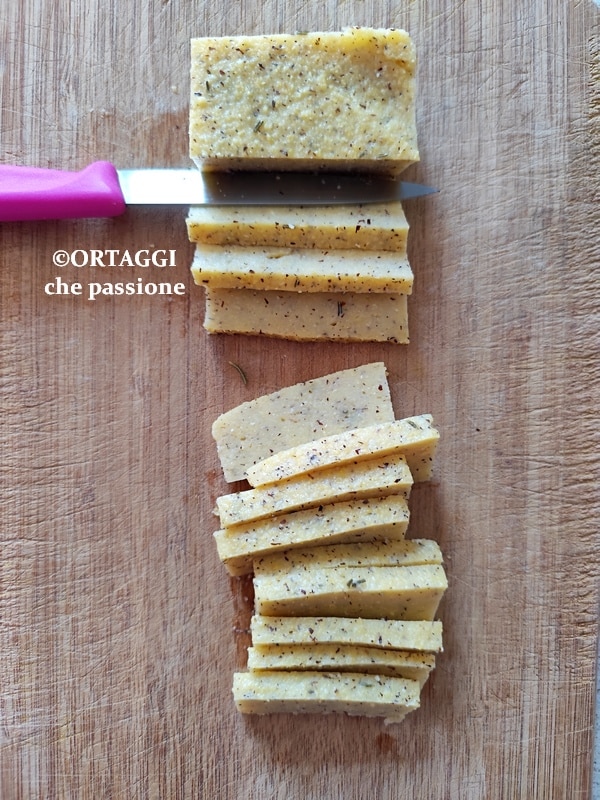 cutting ready polenta into sticks