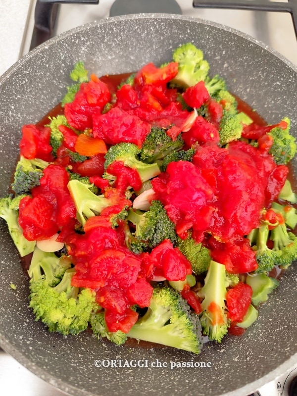 broccoli with tomato sauce in pan