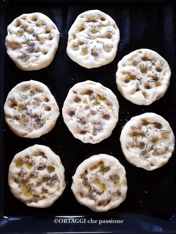 sprinkle the surface with oil, salt, and rosemary