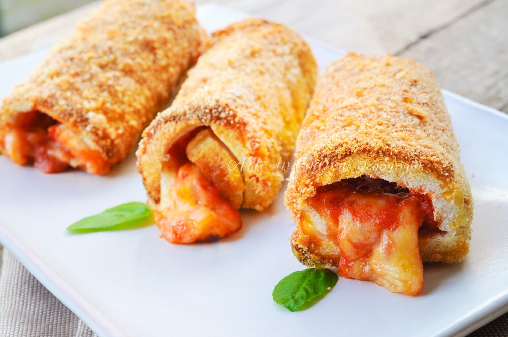 Baked pancarré cannoli with mozzarella and tomato appetizers