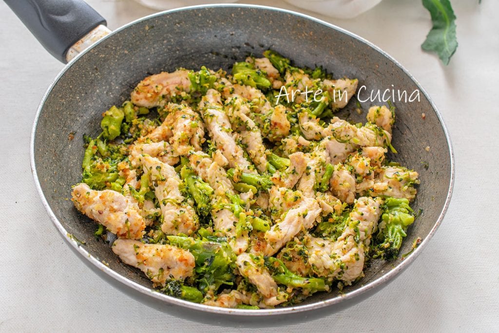 Chicken strips and broccoli in a pan