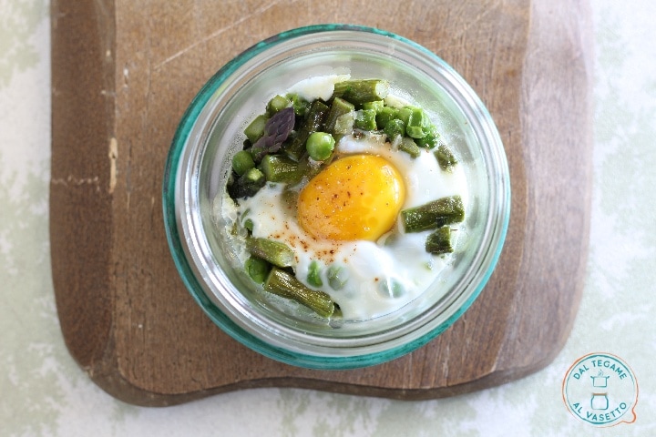 Eggs in jar cooking with asparagus and peas