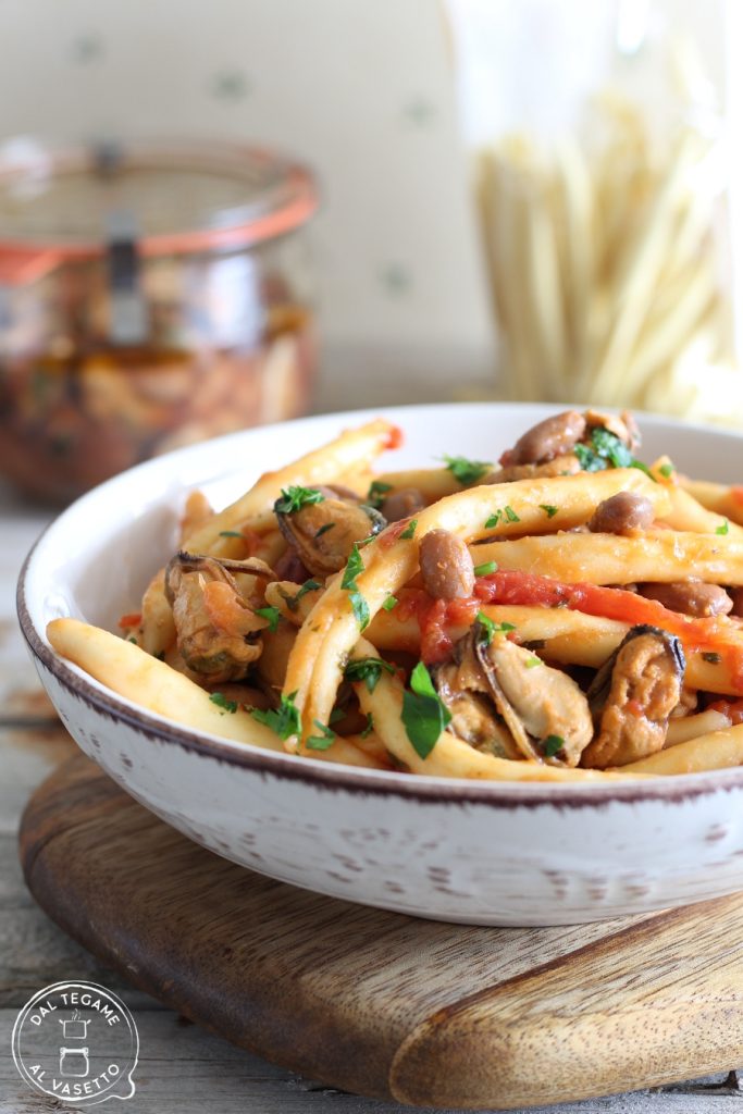 fileja pasta with mussel and bean sauce, tomato and parsley