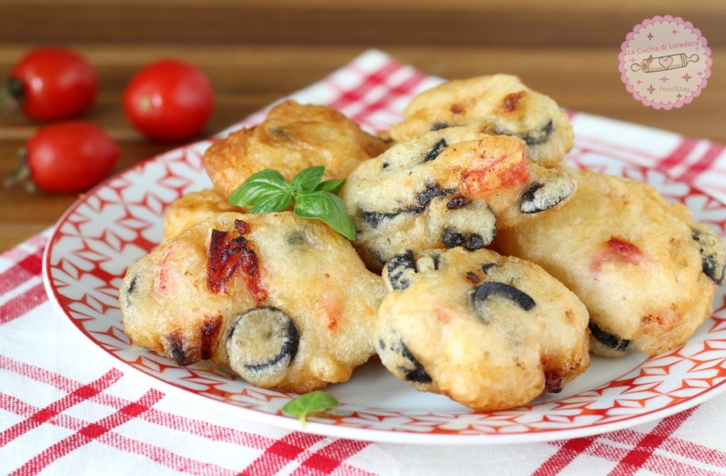 fritters with cherry tomatoes and olives