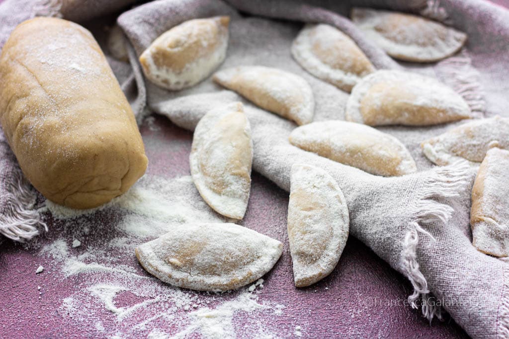 Half-Moon Ravioli Stuffed with Ricotta, Grana, and Mushrooms