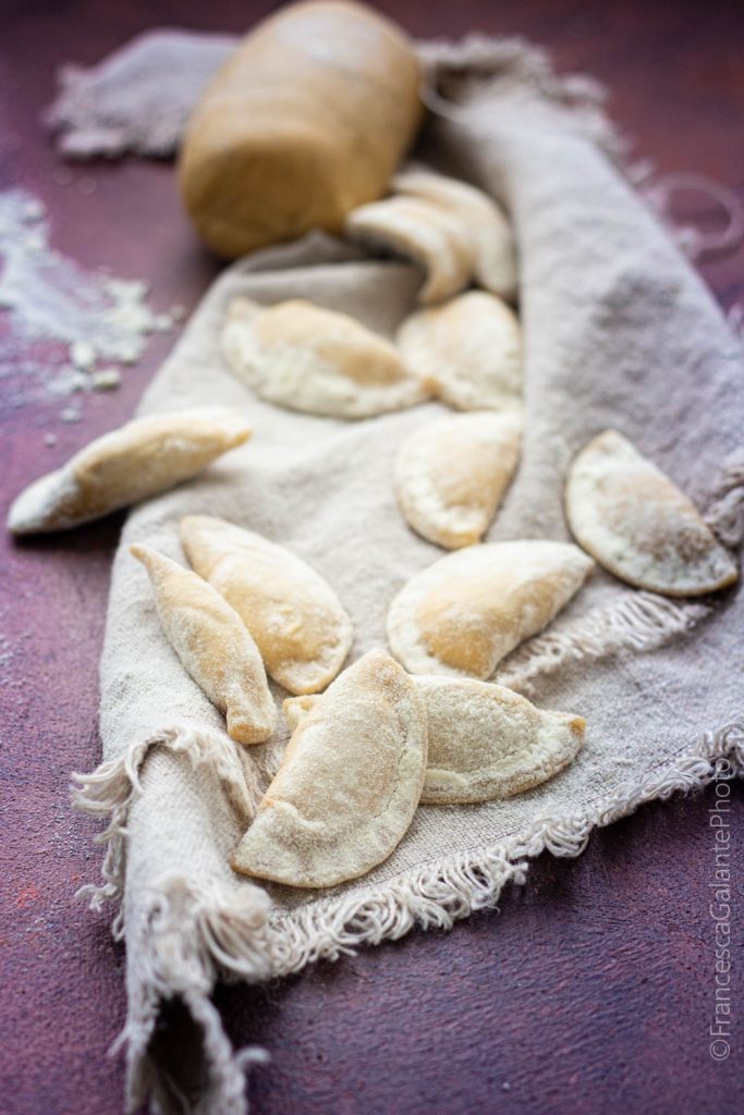Half-Moon Ravioli Stuffed with Ricotta, Grana, and Mushrooms