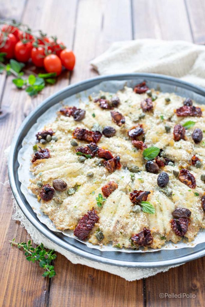 baked anchovies with olives and sun-dried tomatoes