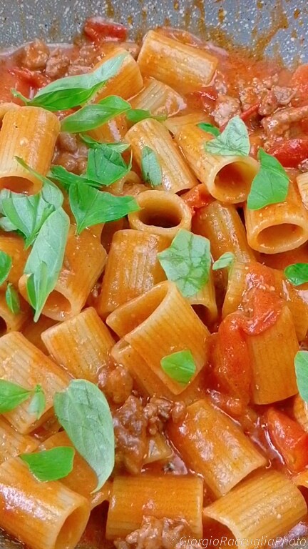mezze maniche with sausage and cherry tomatoes