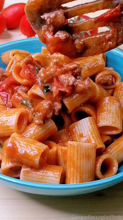 mezze maniche with sausage and cherry tomatoes