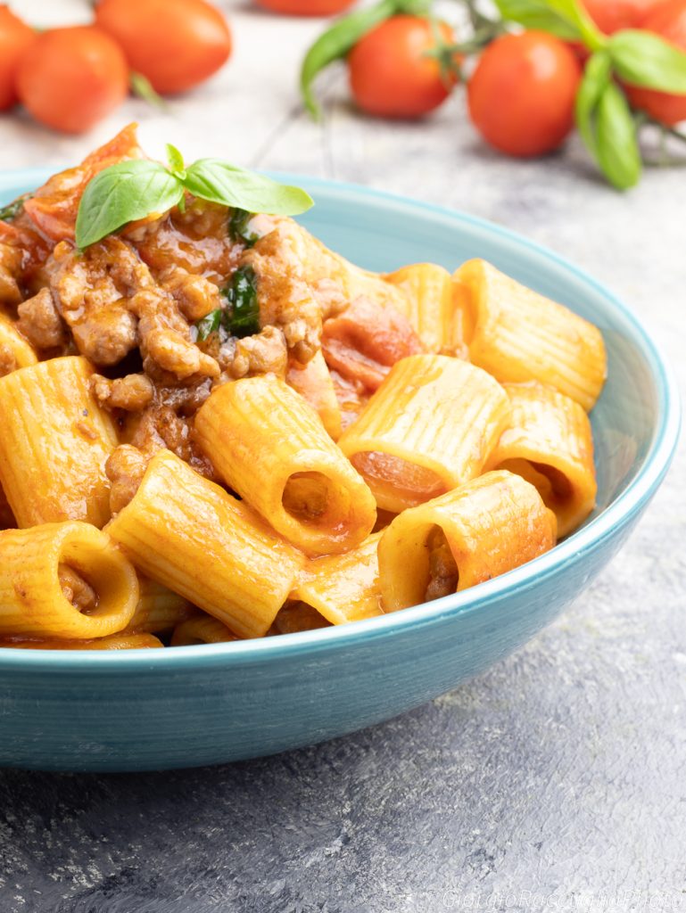 mezze maniche with sausage and cherry tomatoes