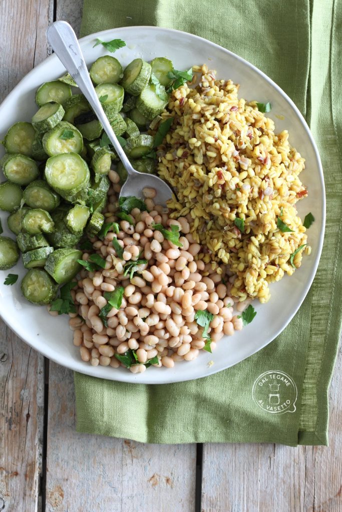 Dish of jar-cooked cereals and zucchini with cannellini beans