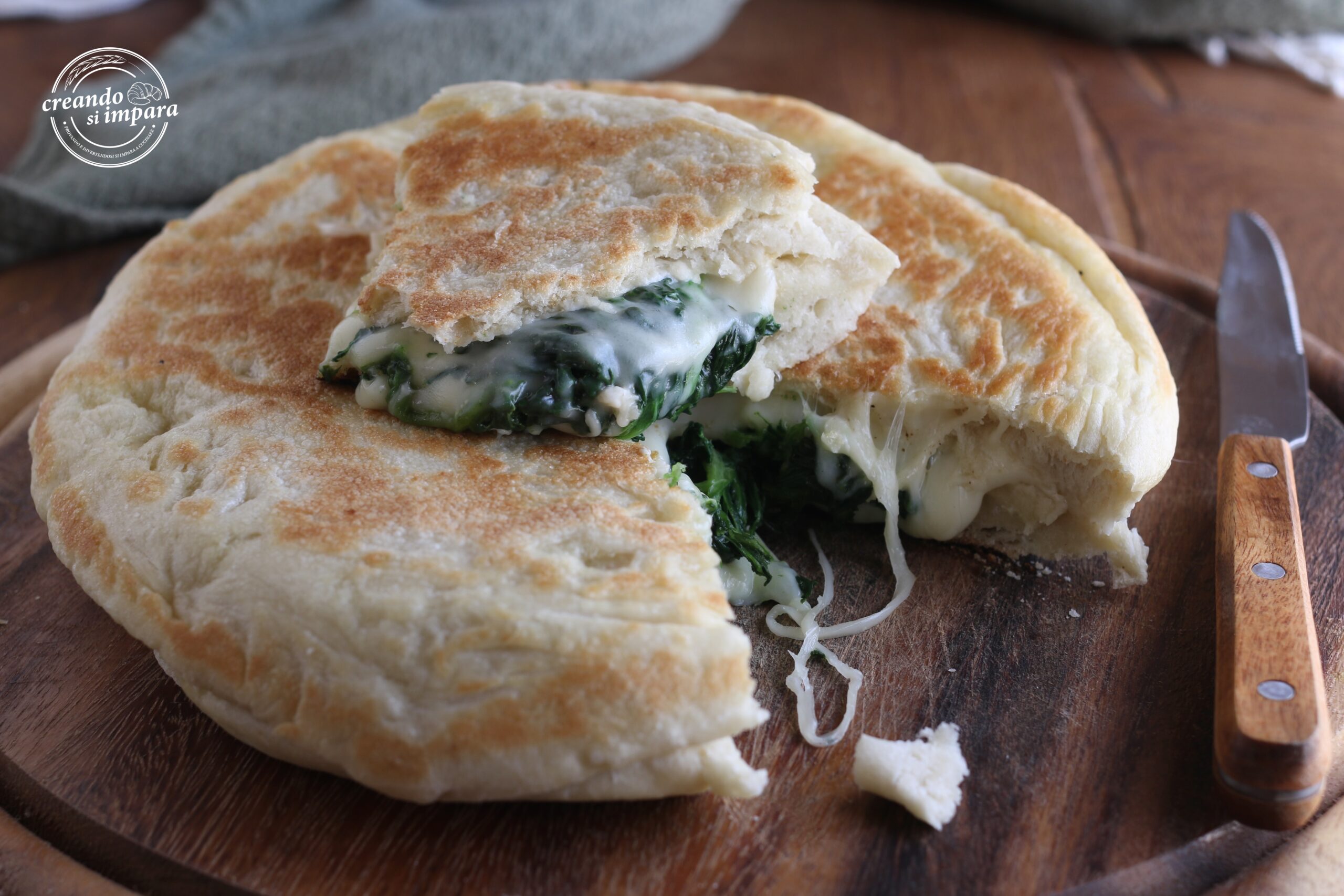pan-fried focaccia with spinach and smoked cheese