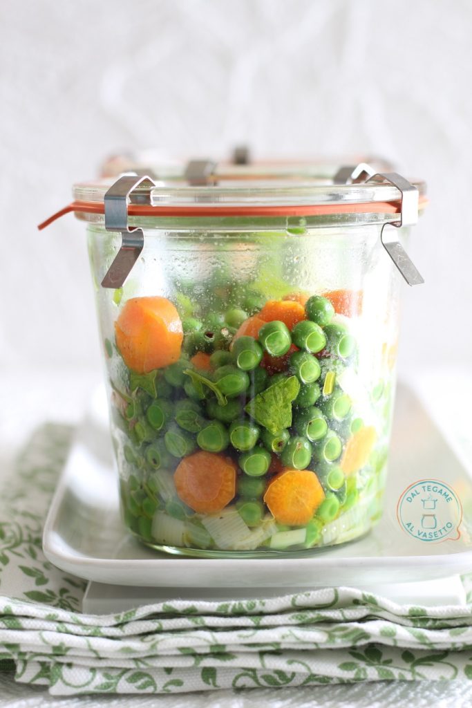 peas and carrots in jar cooking in the microwave
