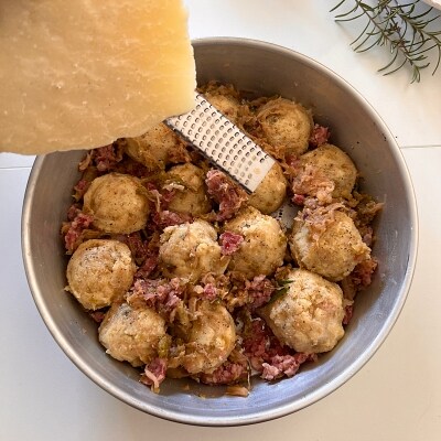 polenta balls in a tray to be cooked in the air fryer