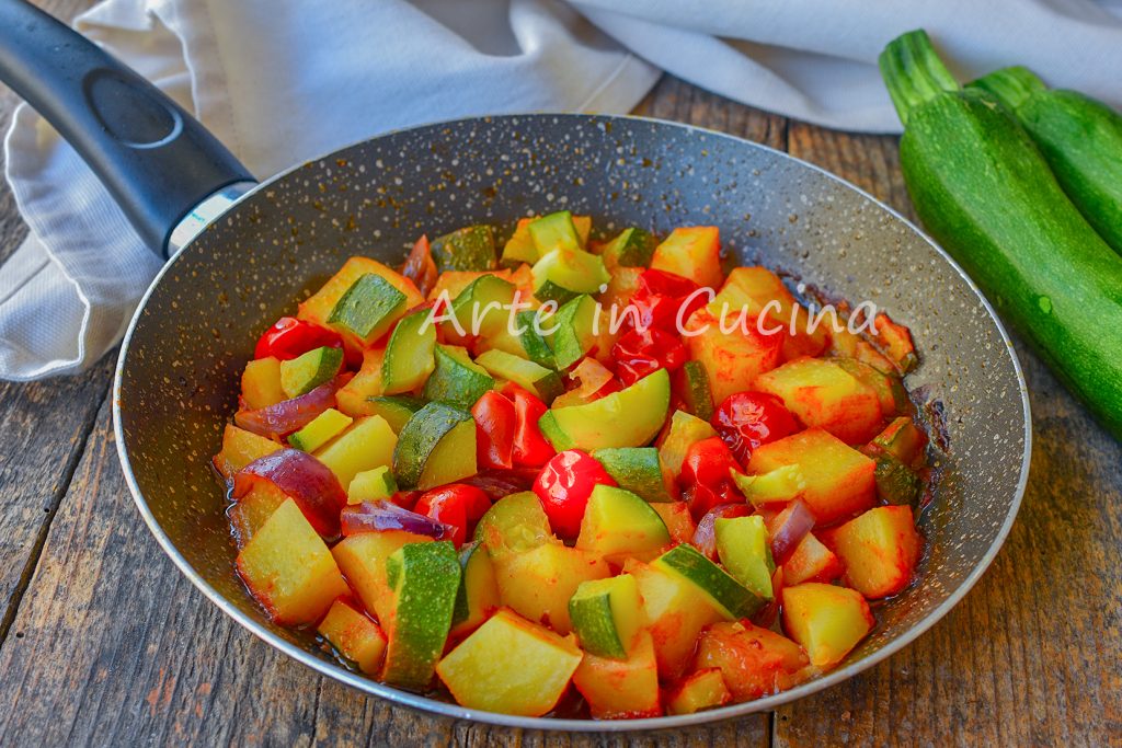 Potatoes and zucchini stewed in pan