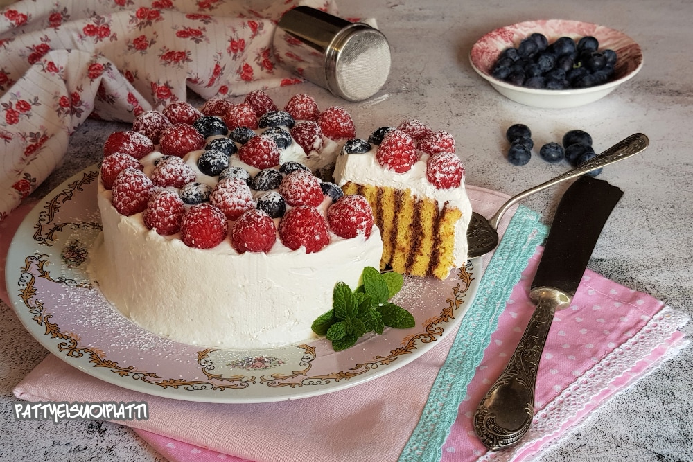 swiss roll cake with cream and berries