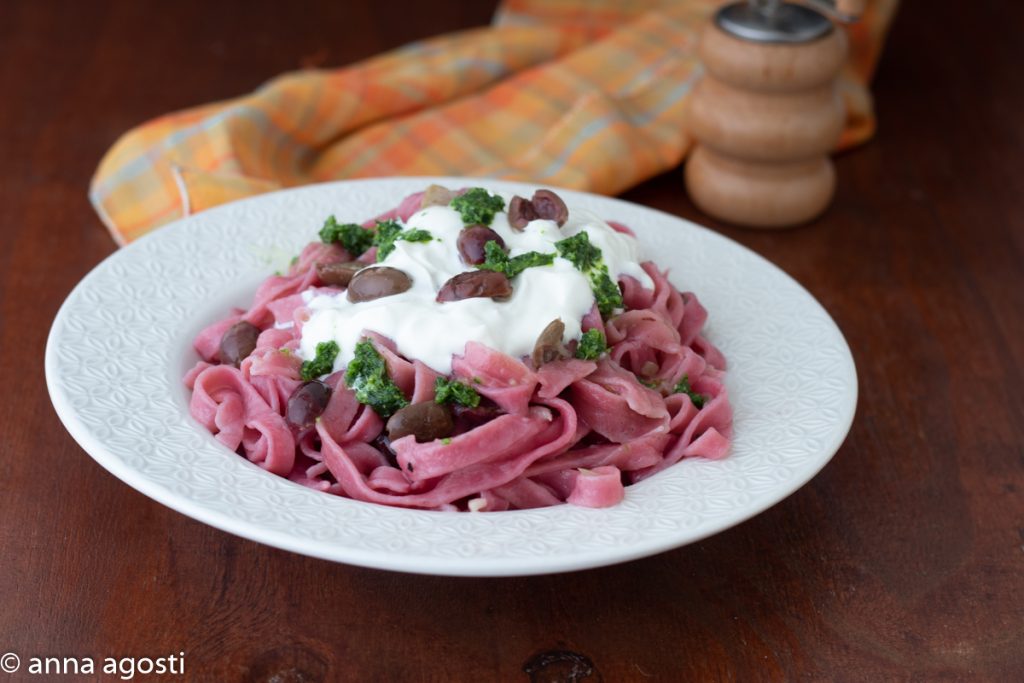 Red tagliatelle with burrata and pesto