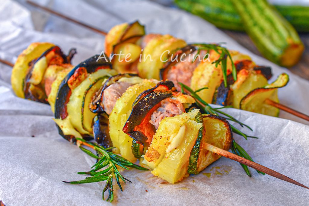 Skewers with Sausages Potatoes and Gratinated Vegetables
