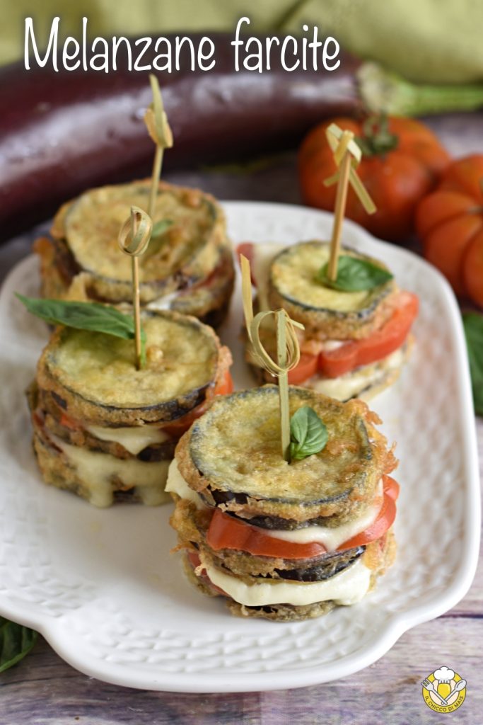v_ eggplant sandwich with tomato and mozzarella club sandwich of fried grilled roasted eggplants the chicco di mais