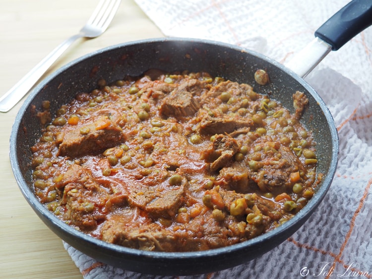 veal stew with tomato sauce and peas ready to be served