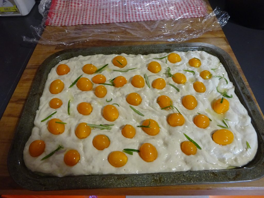 Focaccia with onions and yellow cherry tomatoes