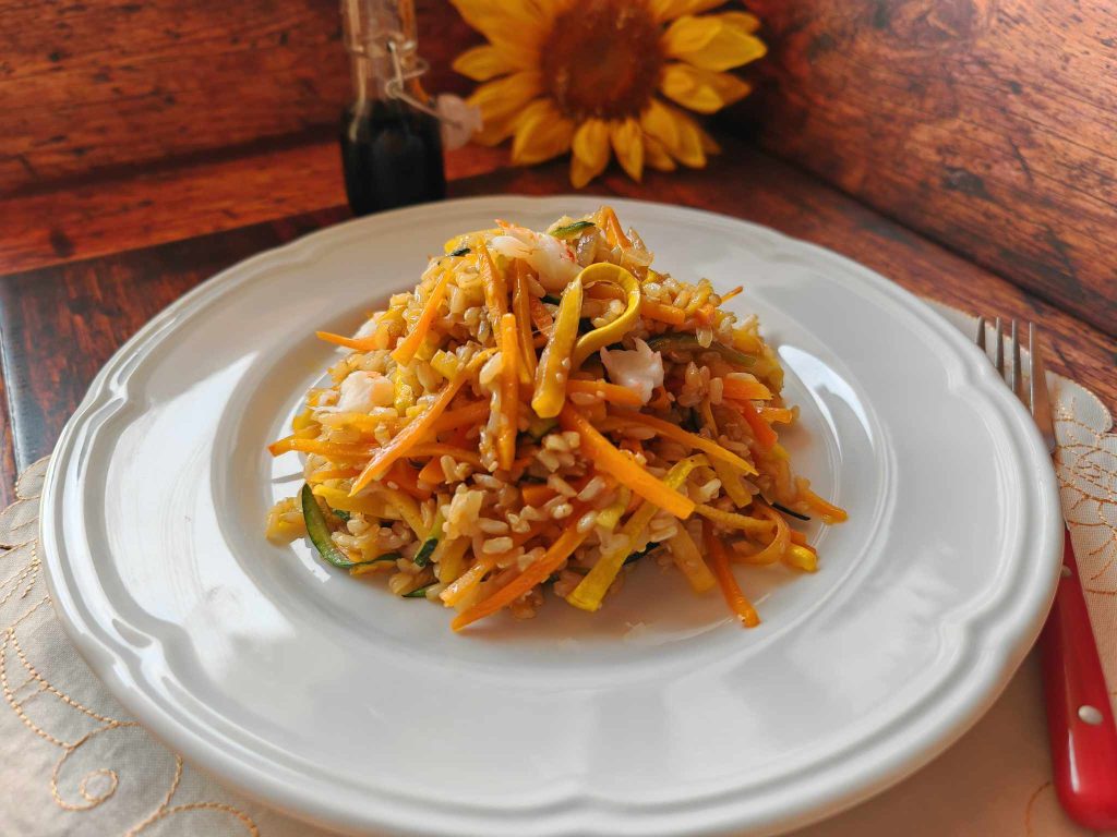 Stir-fried rice with vegetables and soy sauce