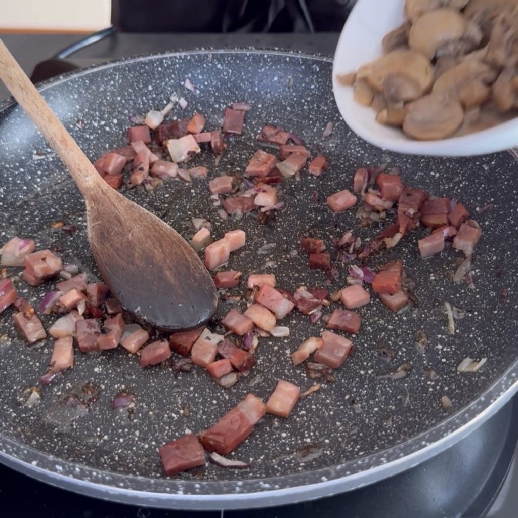 Gnocchi with stracchino mushrooms and speck
