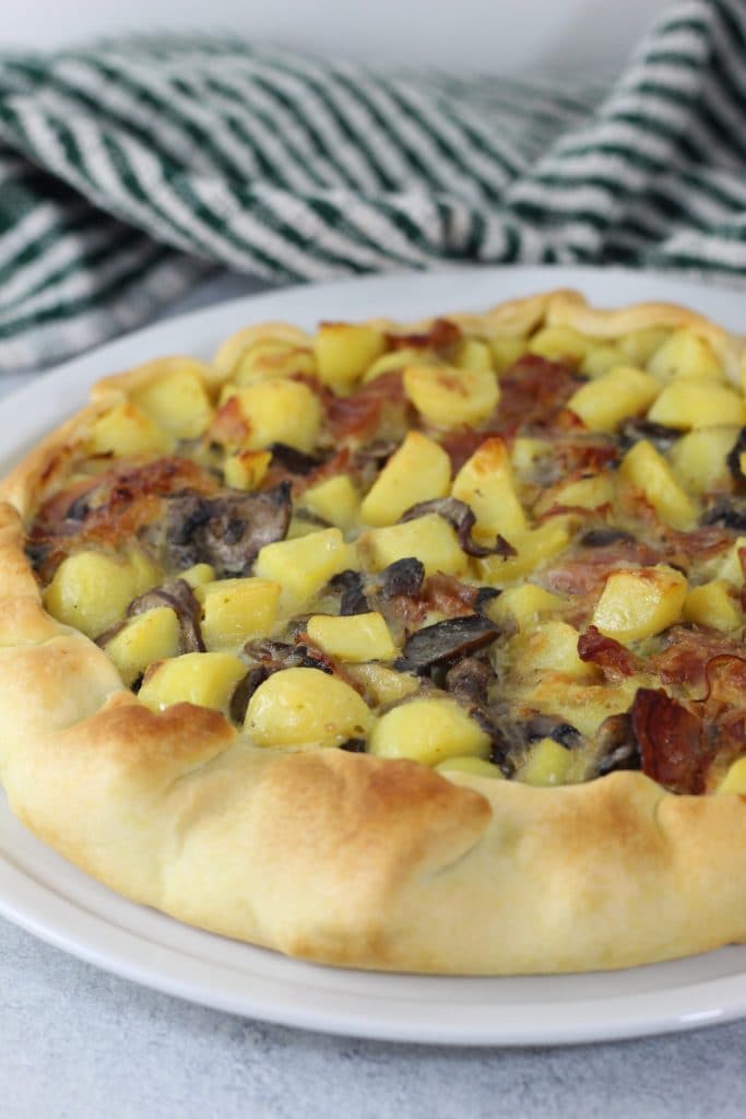 savory pie with potatoes speck and mushrooms