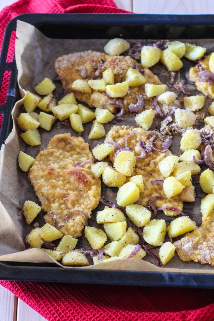 baked chicken breast with potatoes and onions