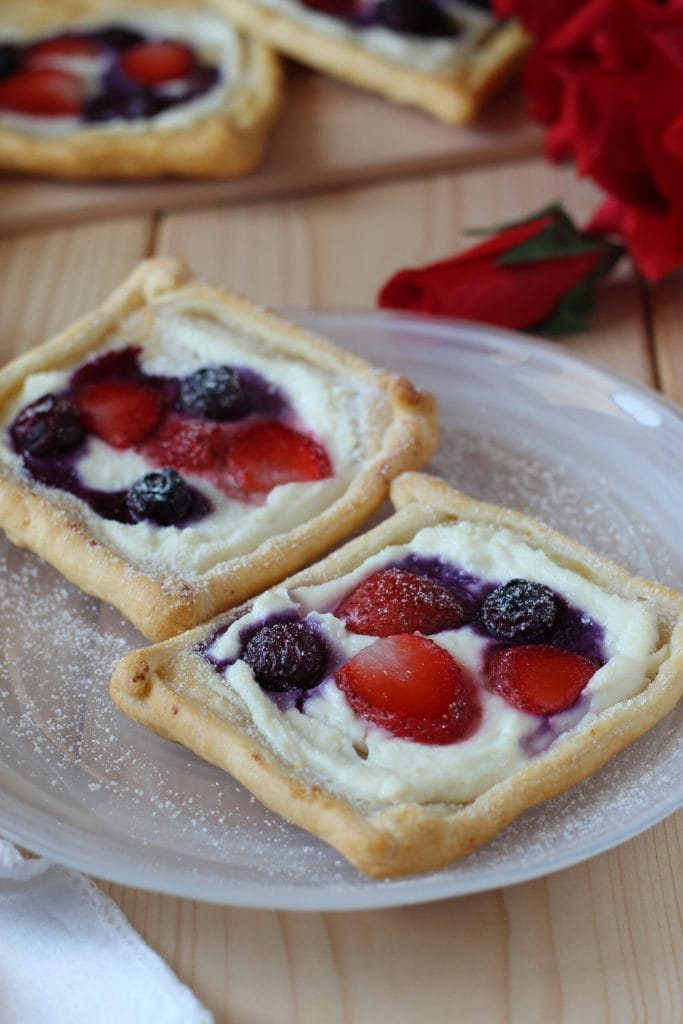 puff pastries with ricotta, strawberries, and blueberries