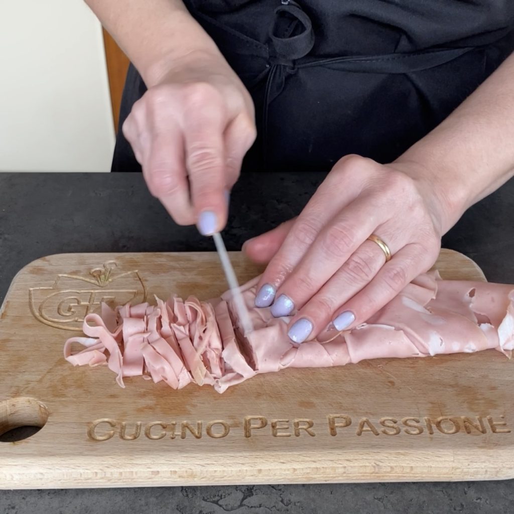 Meatballs with mortadella in sauce