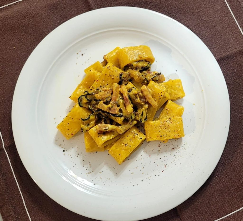 pasta with saffron cream, guanciale, and zucchini