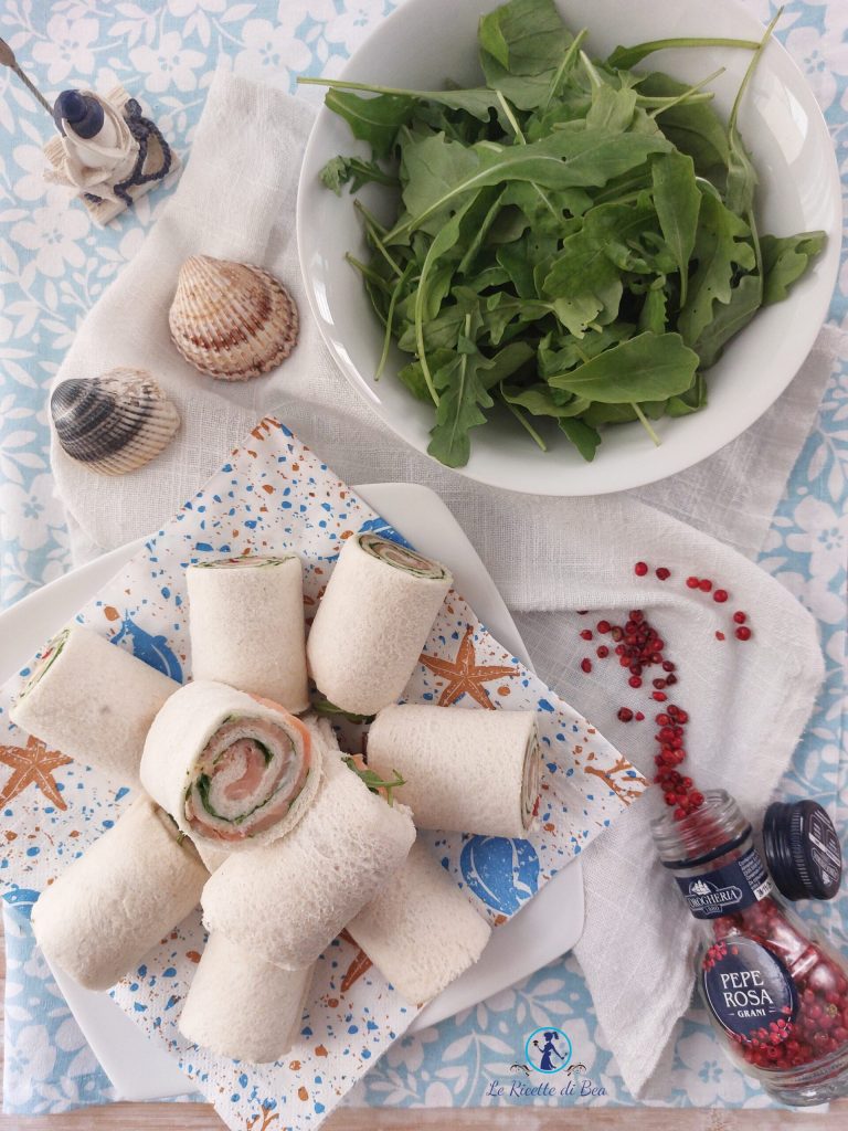 rolls with salmon and arugula