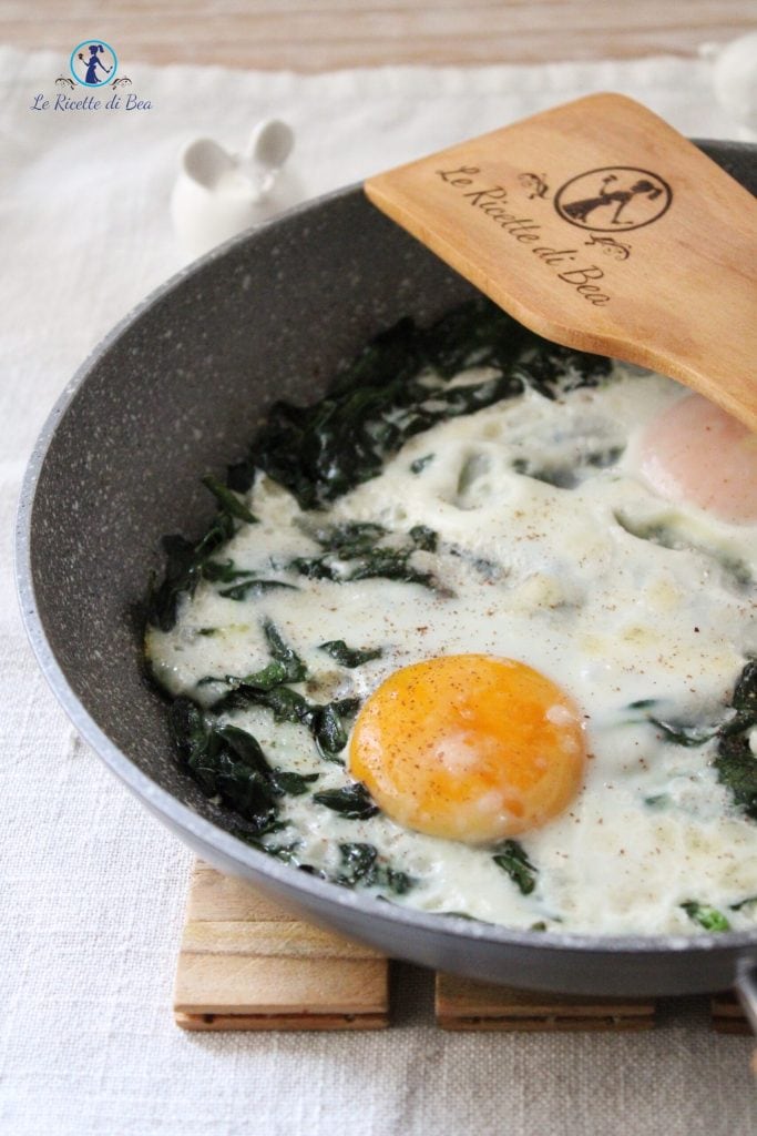 spinach and eggs in pan